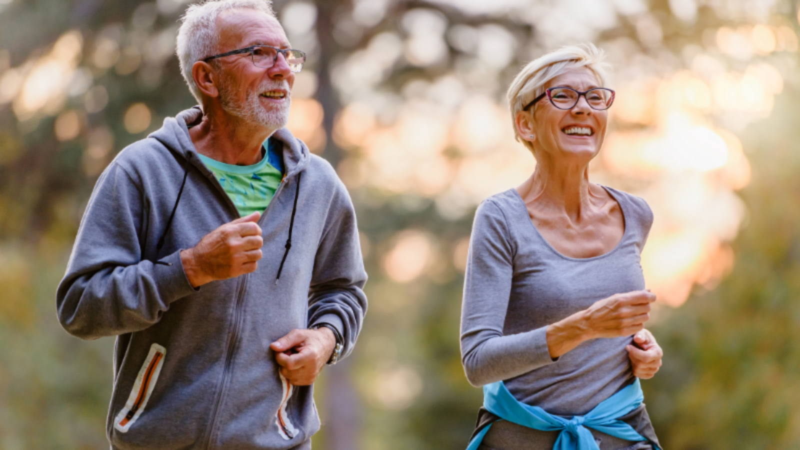 Older couple running to improve motor skills and overall health and to help lower Parkinson's Disease risks