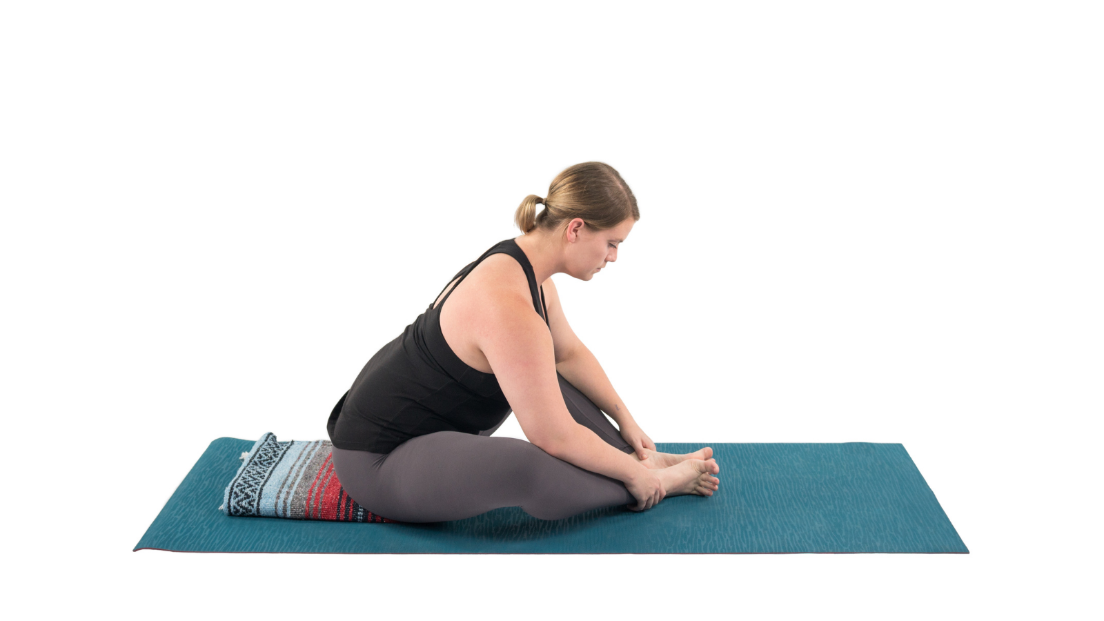 Woman practicing Baddha Konasana (Bound Angle Pose)