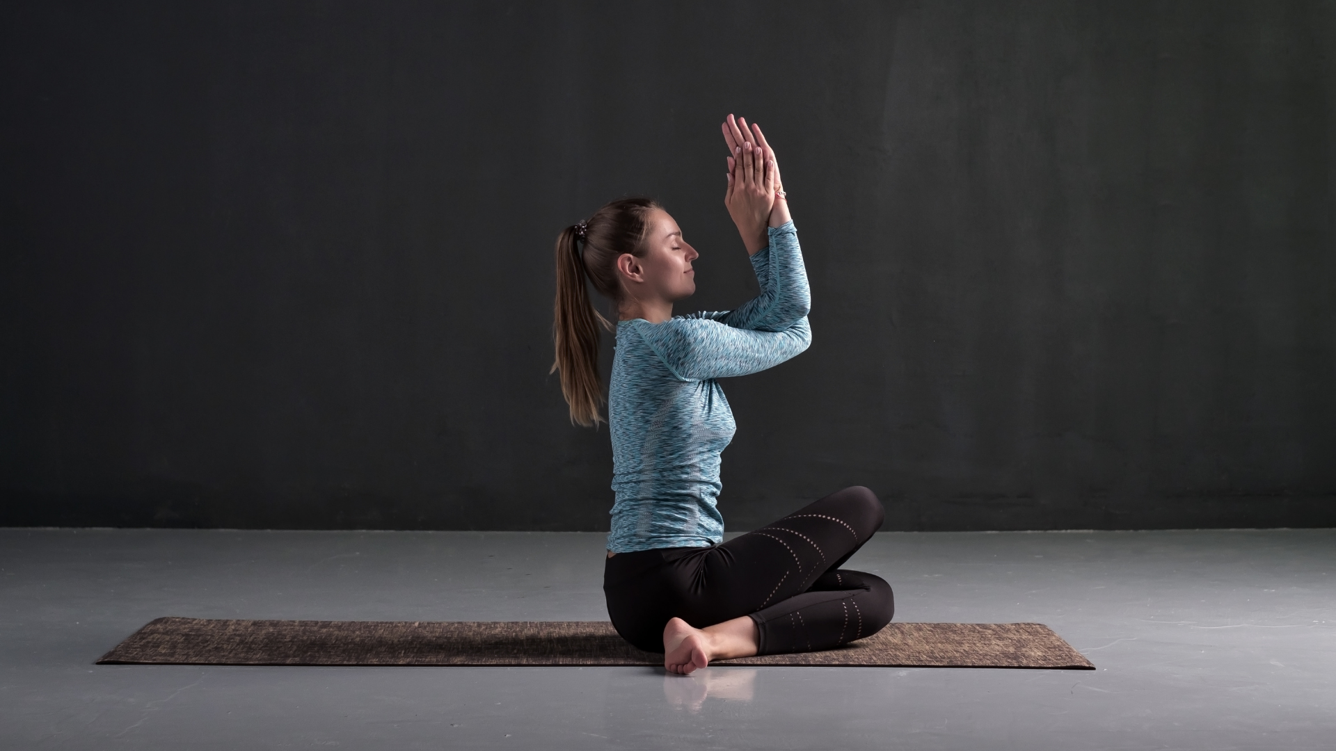 Seated yoga asana with Eagle (Garudasana Arms)