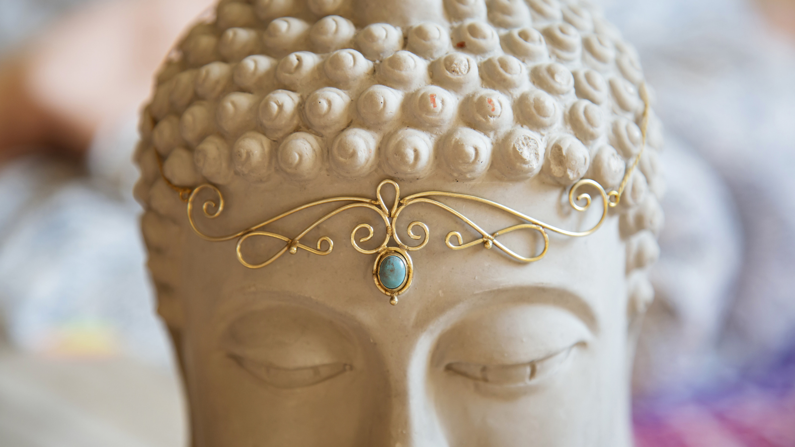 Brass tiara with gemstone at the third eye on Buddha statue head