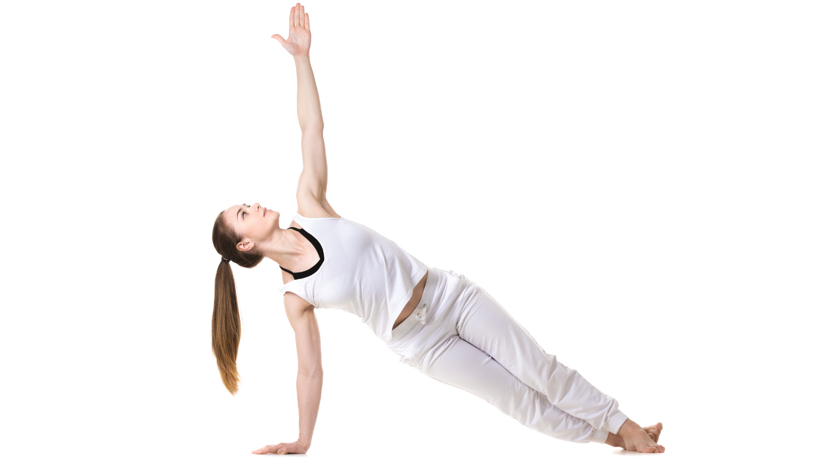 Young yoga practioner doing yoga's Side Plank Pose or Vasisthasana