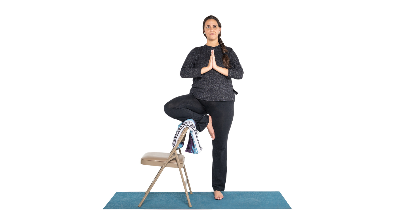 Tree Pose or Vrksasana variation using the support of a chair as a prop