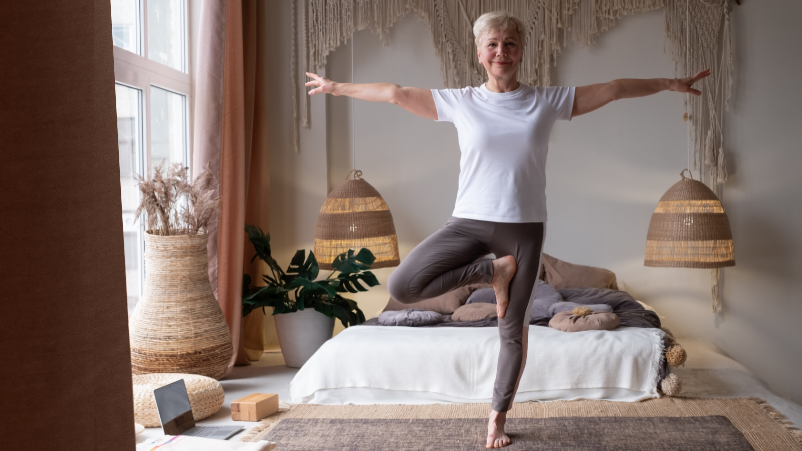 Senior woman in yoga pose Vrikshasana or Tree Pose a wonderful balance pose