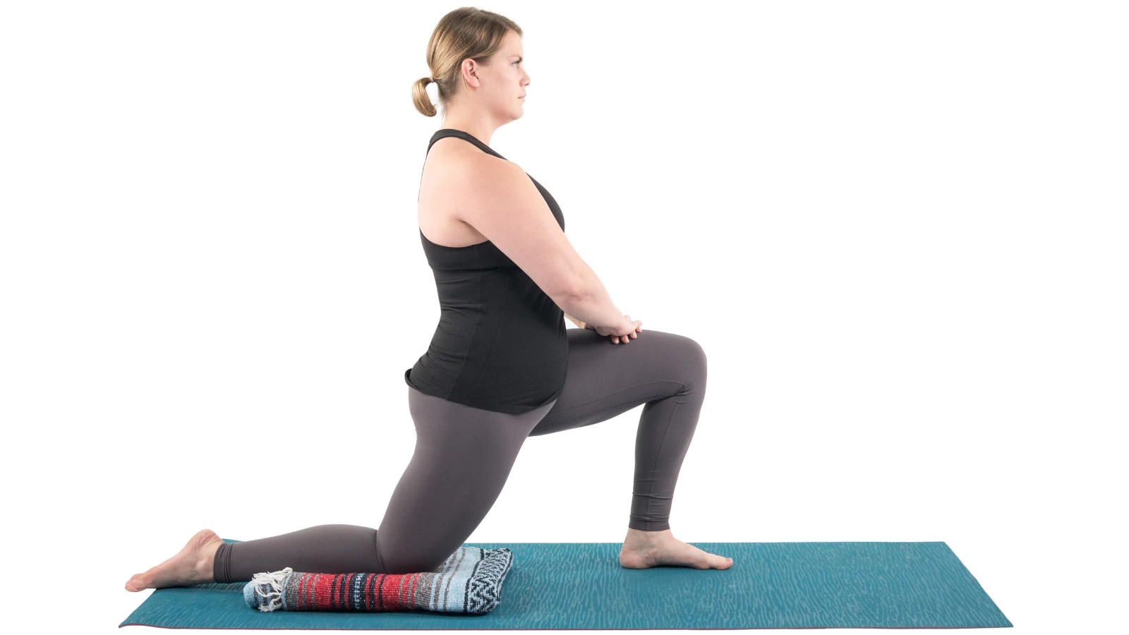 Yoga student demonstrating how to do a beginner variation of Low Lunge Pose (Sanskrit name: Anjaneyasana)