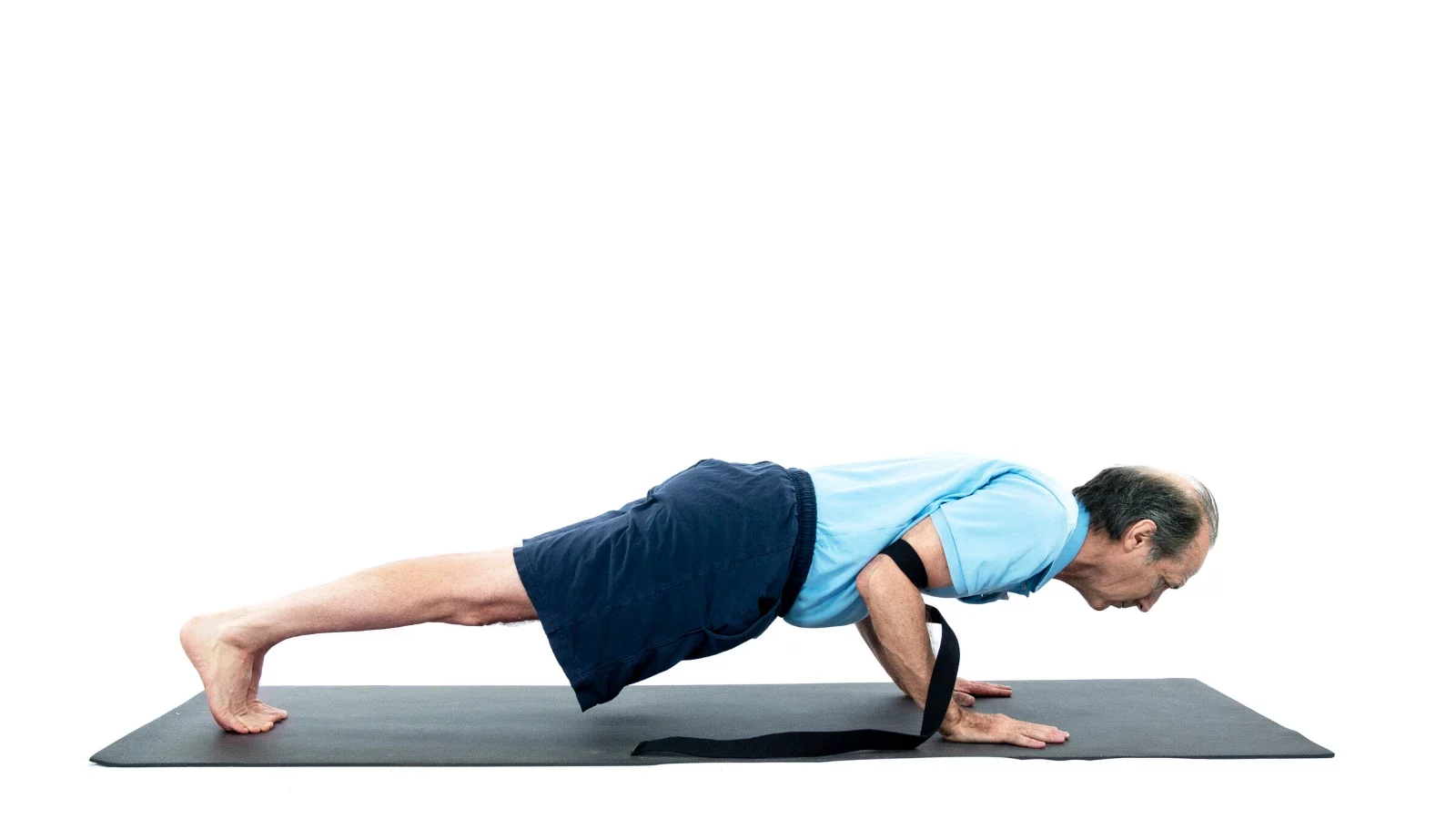 Strong woman in tracksuit doing push up plank in yoga pose breathing -  enjoying recreation at pool t Stock Photo by GaudiLab