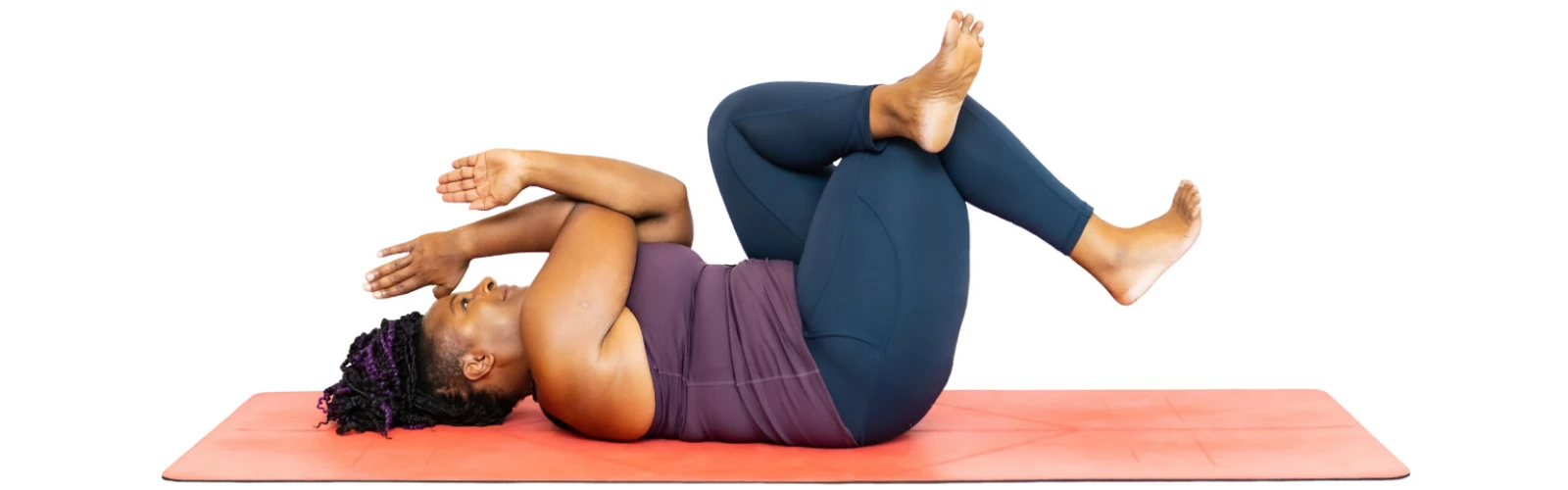 Beginner yoga student demonstrates how to practice a modification of Eagle Pose (Sanskrit name: Garudasana)