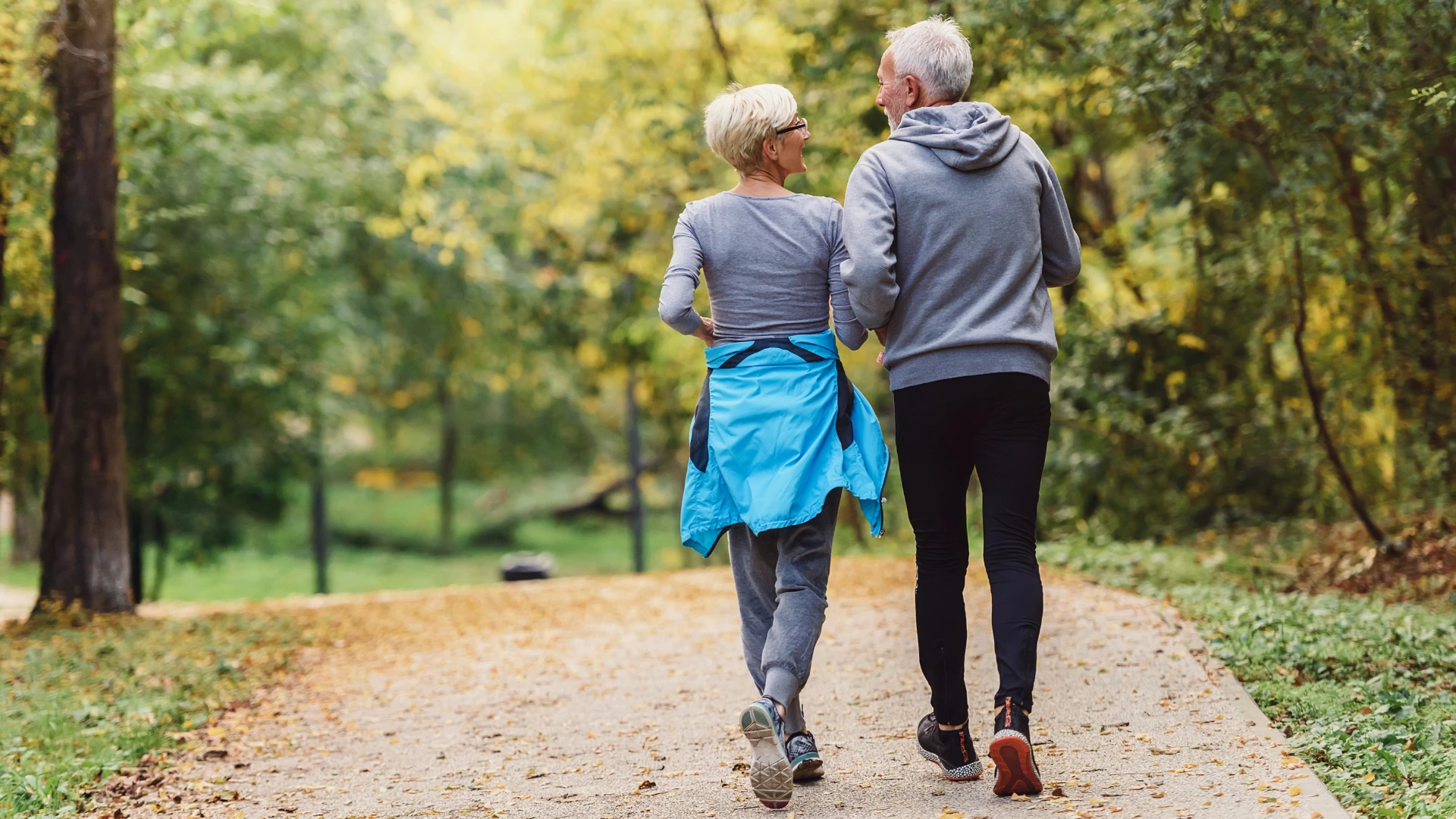 Old couple exercising together and in nature key for healthy vibrant aging 