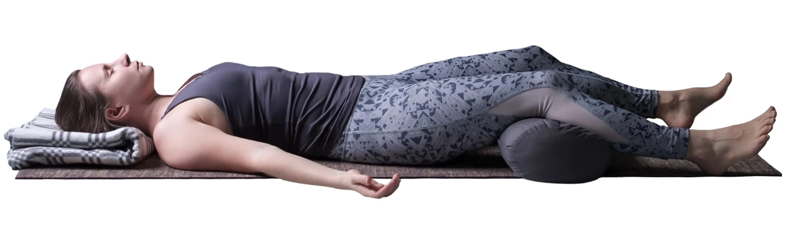 Corpse Pose (Savasana) with bolster and blanket