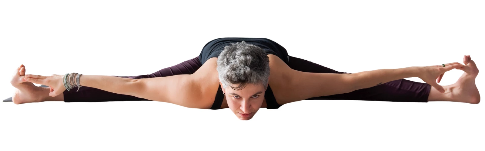 Wide-Angle Seated Forward Bend (Upavistha Konasana) holding feet