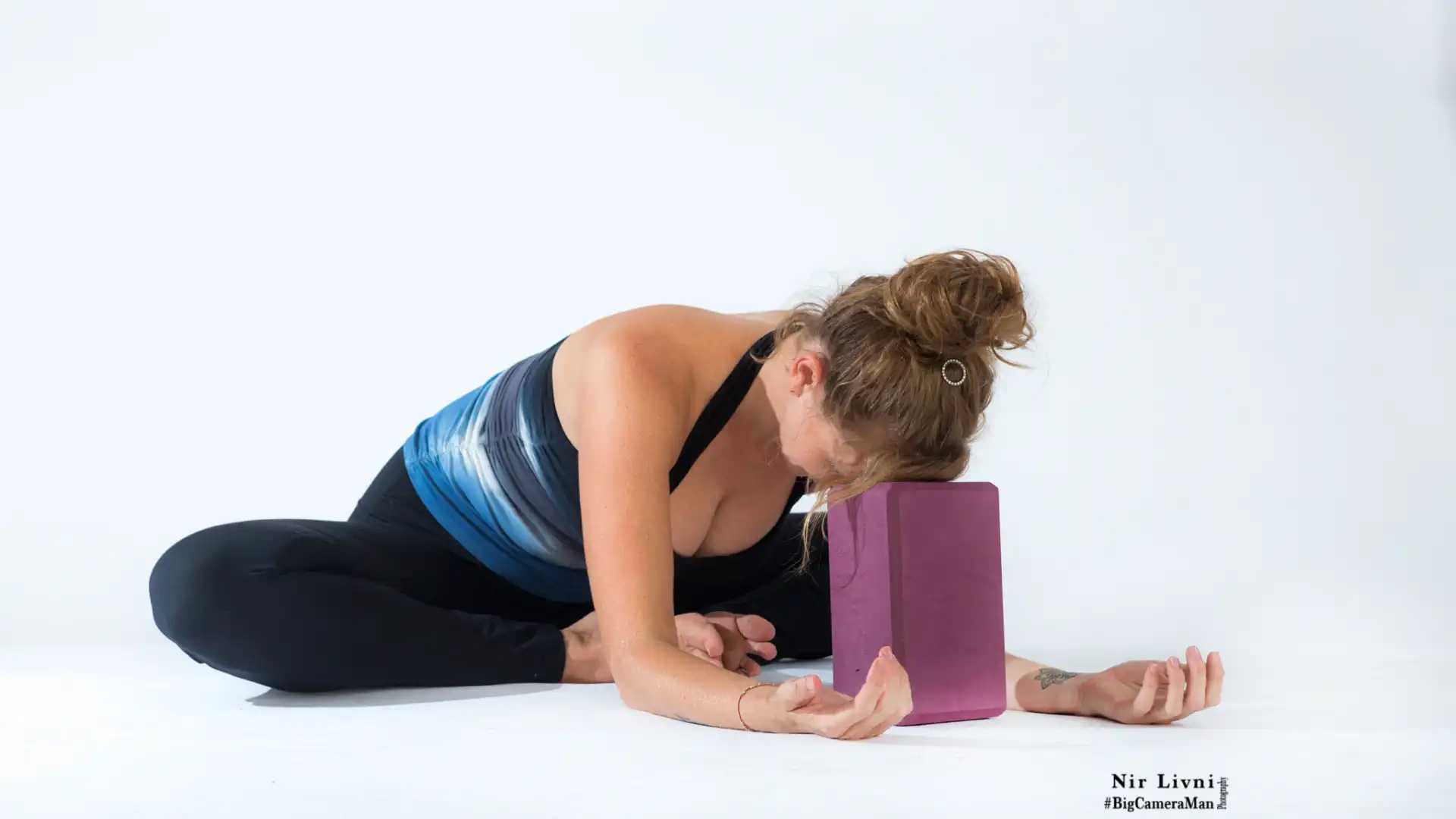 Woman practicing bound angle pose.