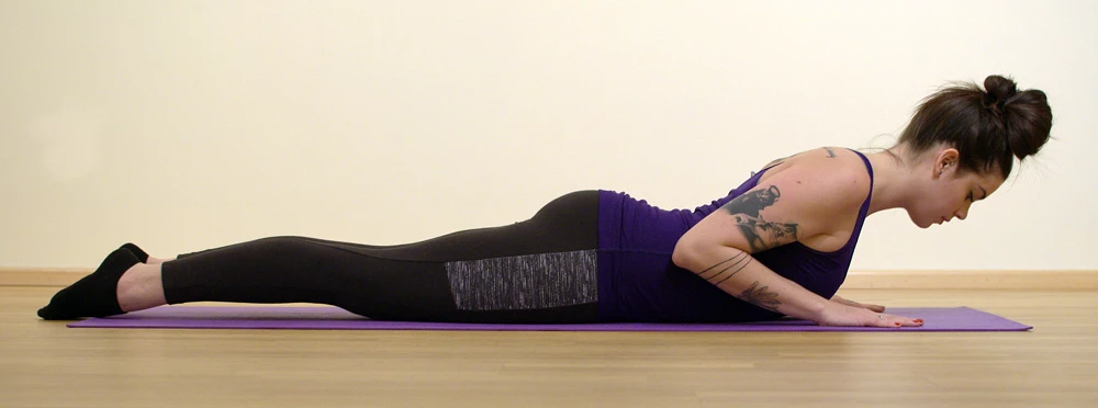 A yoga student in Cobra Pose (Bhujangasana) practicing correctly