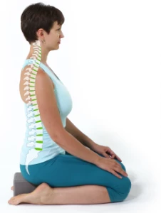 Woman in Seated yoga Pose (vajrasana) demonstrating good posture