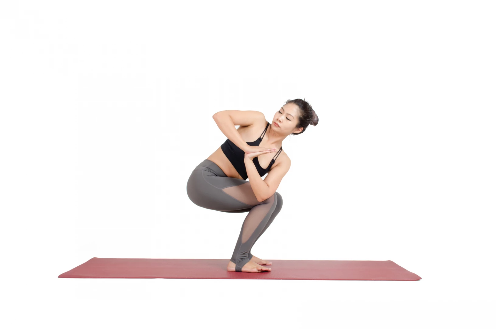 Young fit woman practicing yoga exercise called: Twisted Chair Pose  sanskrit name: Parivrtta Utkatasana Stock Photo - Alamy