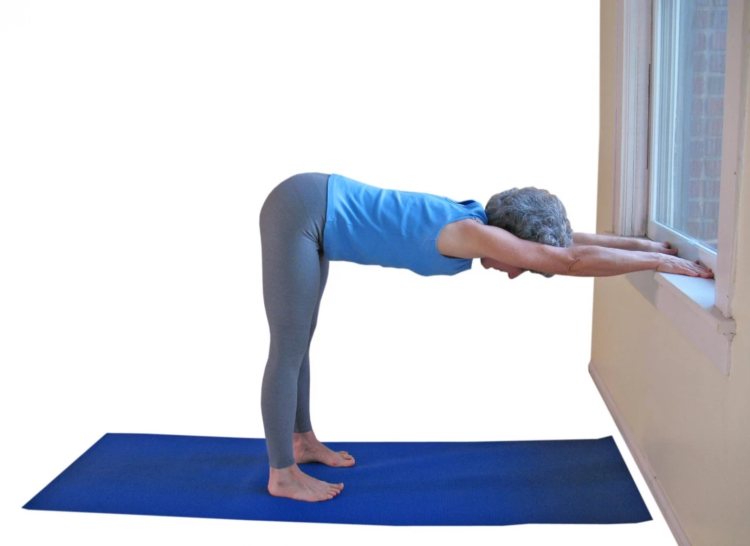 lillah schwartz practicing Downward Dog Prep yoga pose a therapeutic yoga for backpain