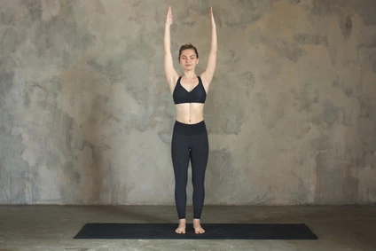 woman practicing yoga in Upward Hands Pose (Urdhva Hastasana)