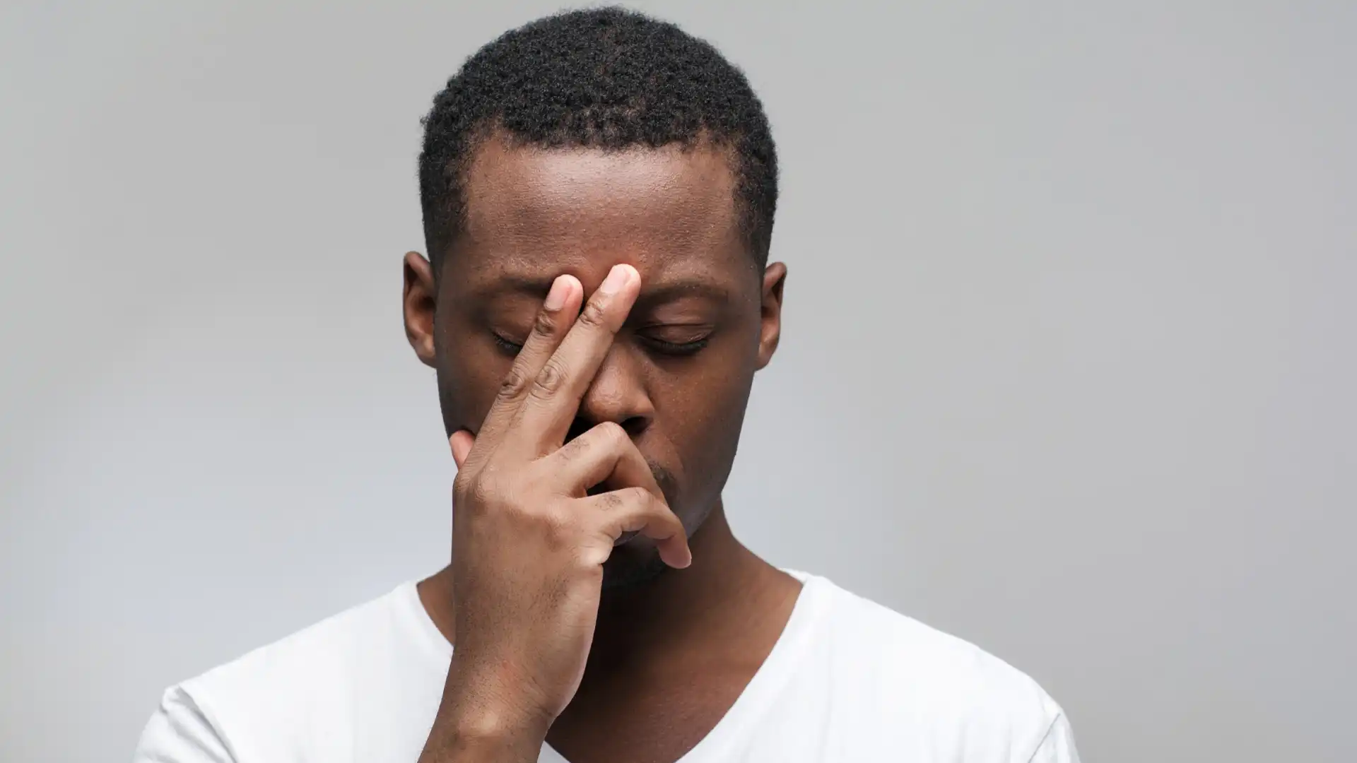 Man practicing yoga pranayama breath work. 