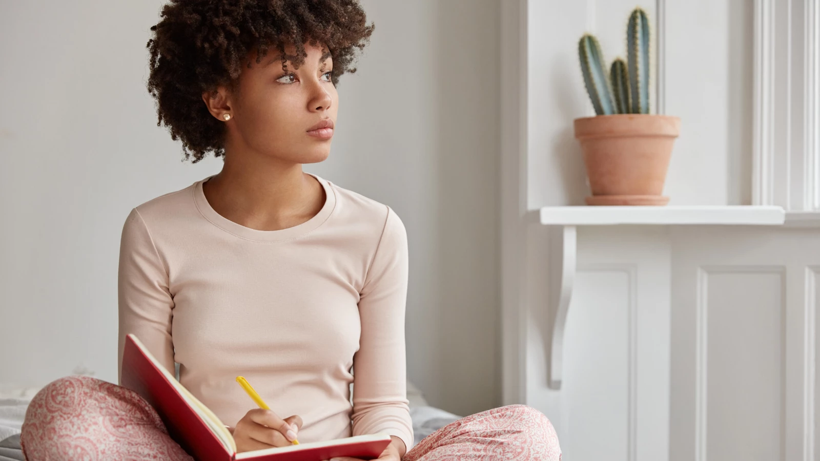 Woman journaling at home.