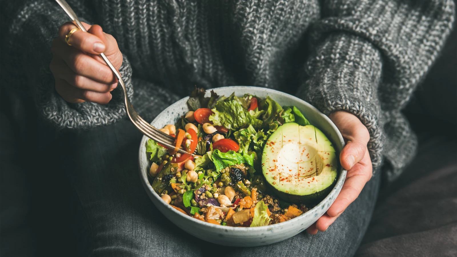 Woman eating healthy vegetarian meal.