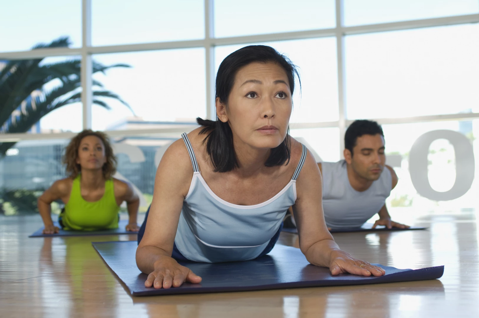 group of diverse people practicing yoga