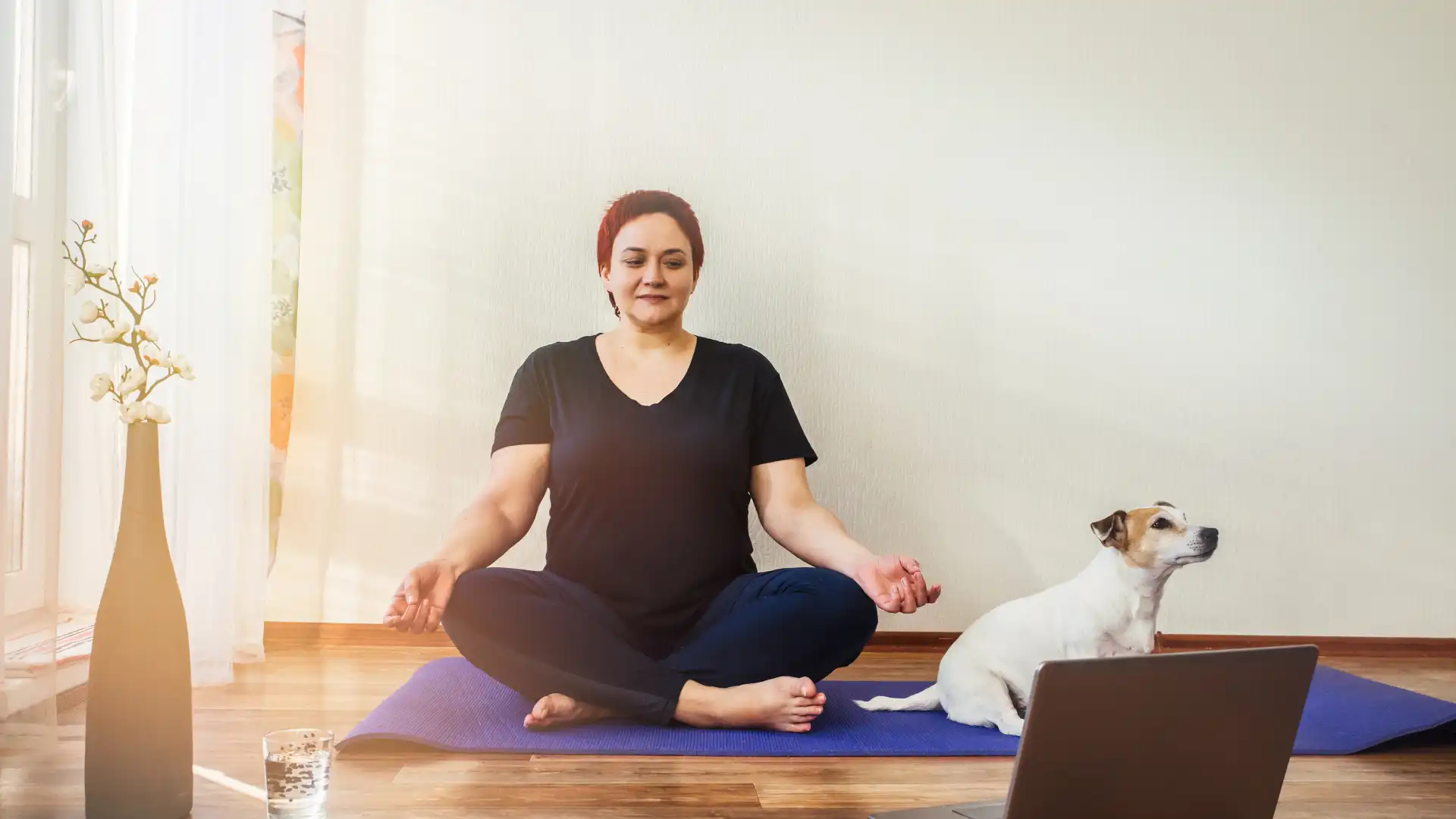 female_yoga_student_practicing_online_yoga_meditation