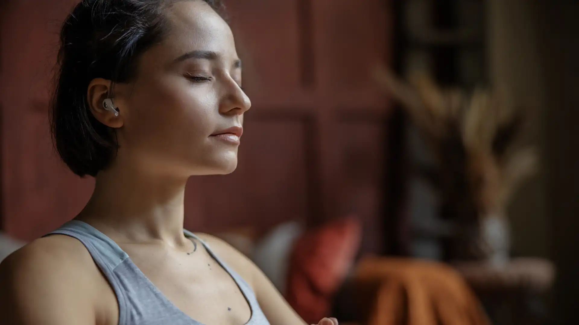 Woman practicing yoga meditation with eyes closed.