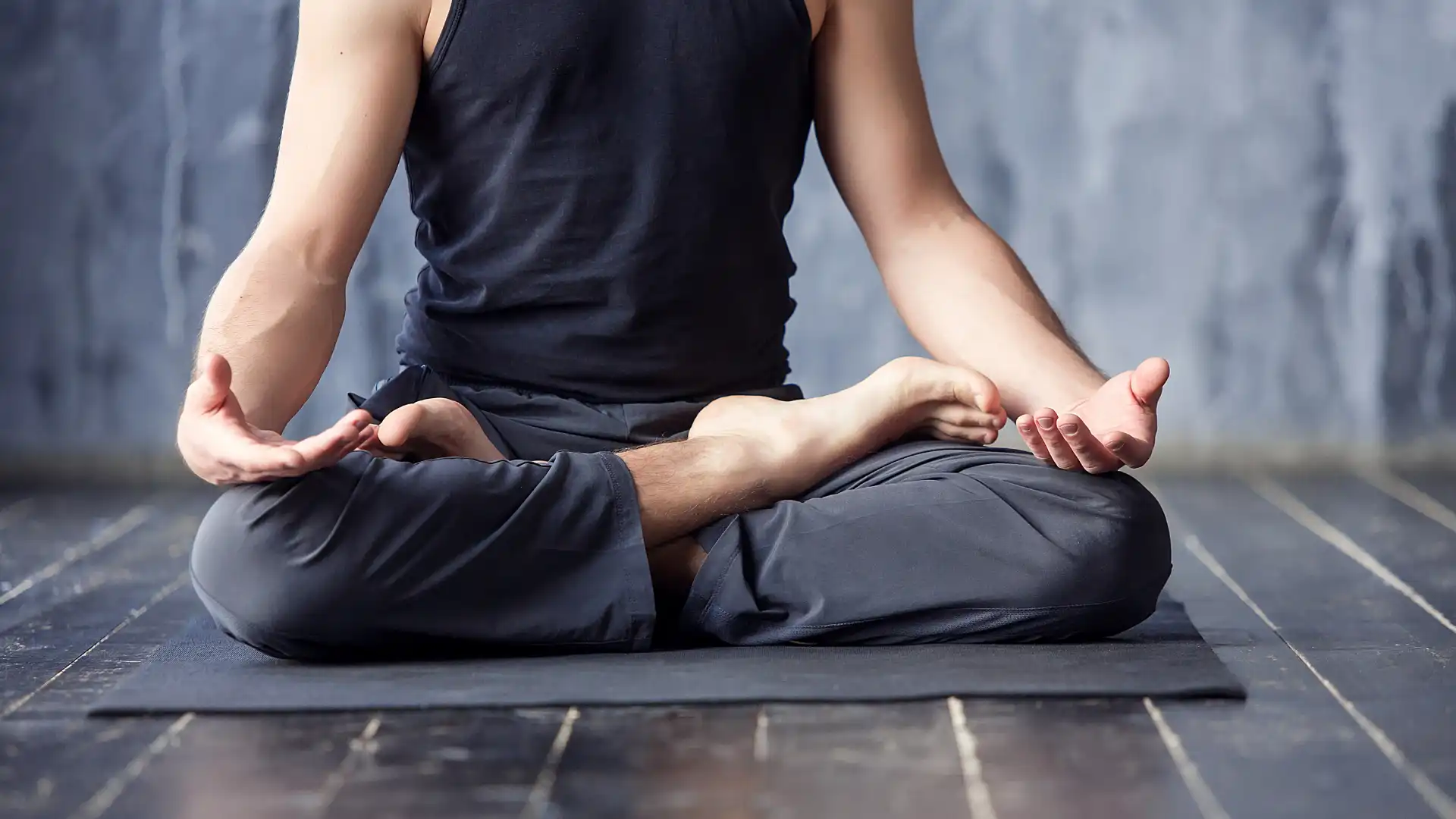 Closeup of man practicing yoga meditation.