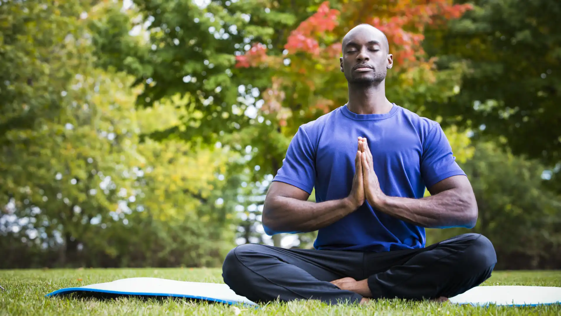 Man practicing yoga meditation and gratitude which can positively change the brain and body