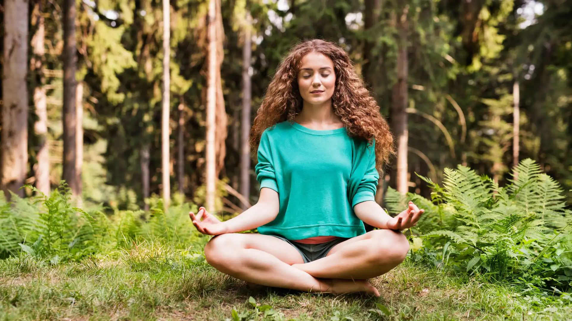 Woman practicing yoga meditation with eyes closed.