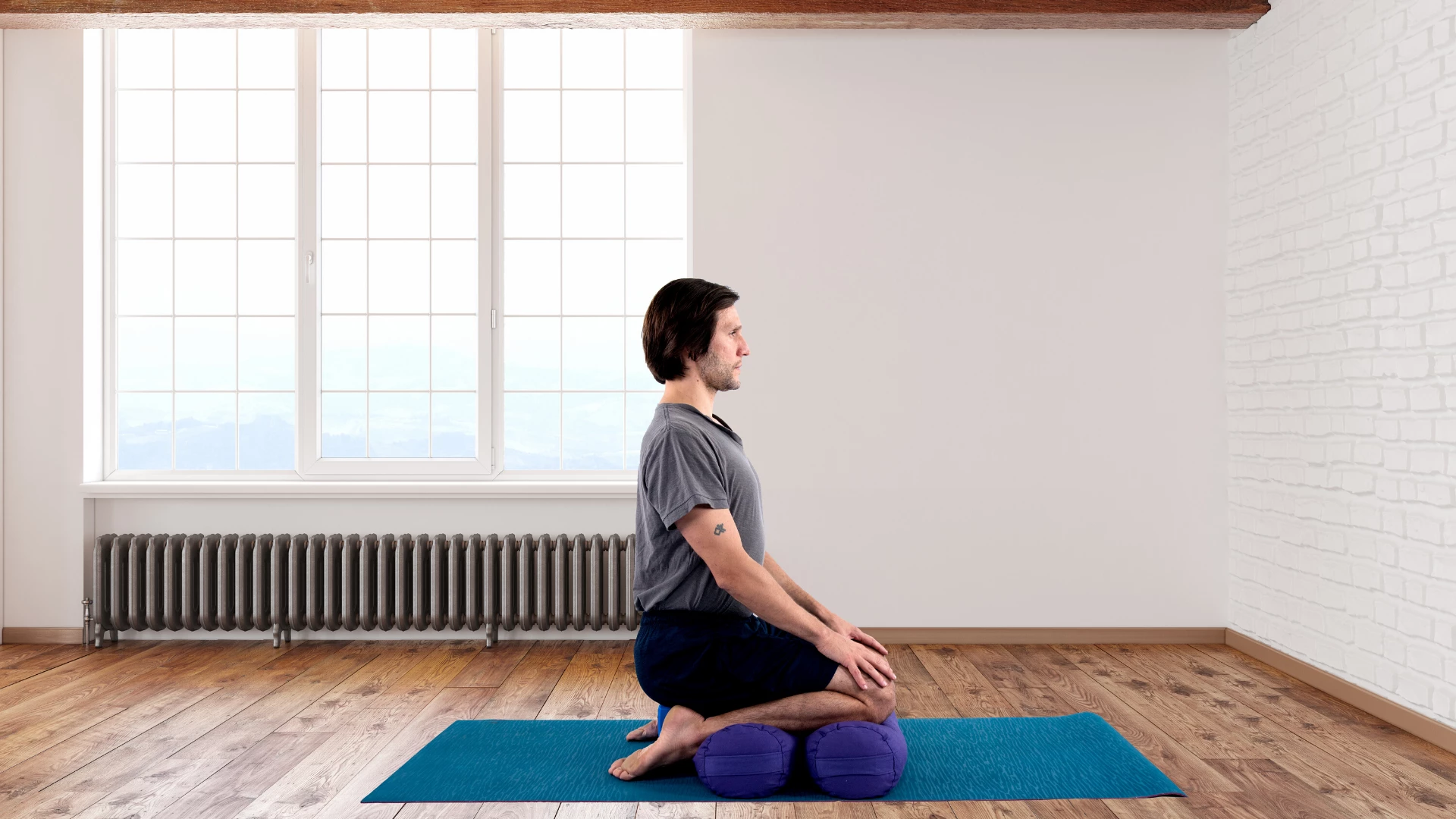 Man practicing yoga hero pose.