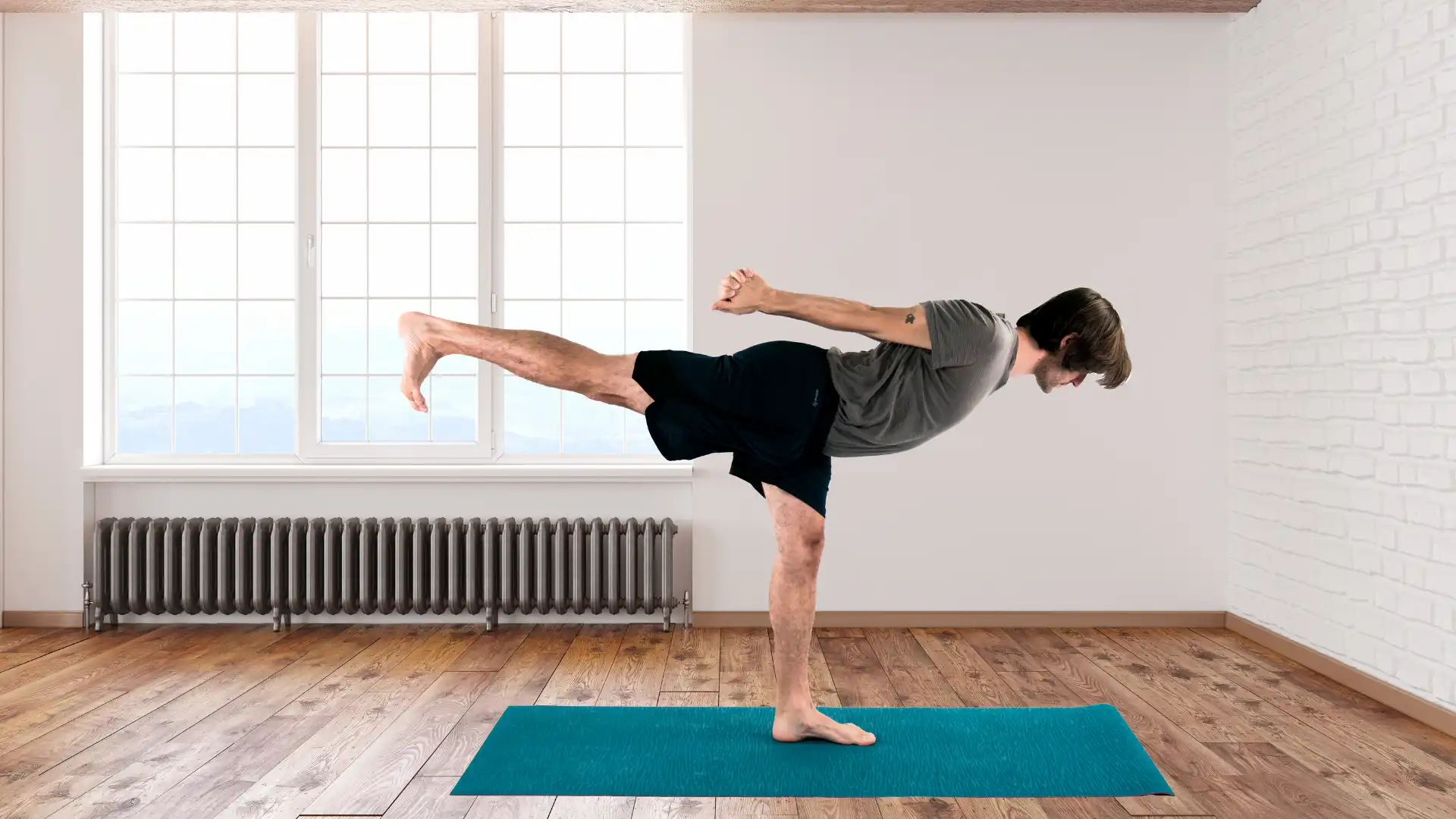 Man practicing yoga warrior III pose.