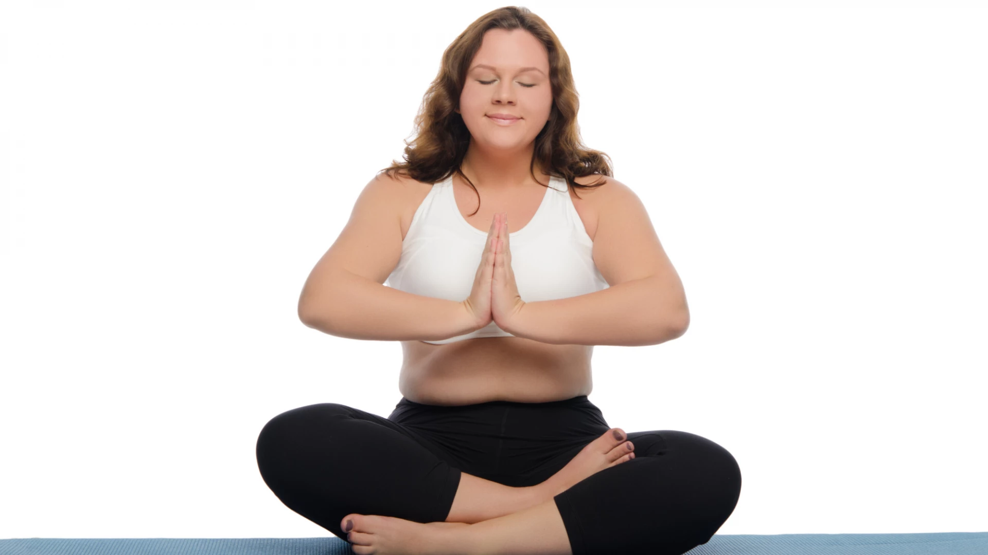 Woman practicing yoga meditation at home.