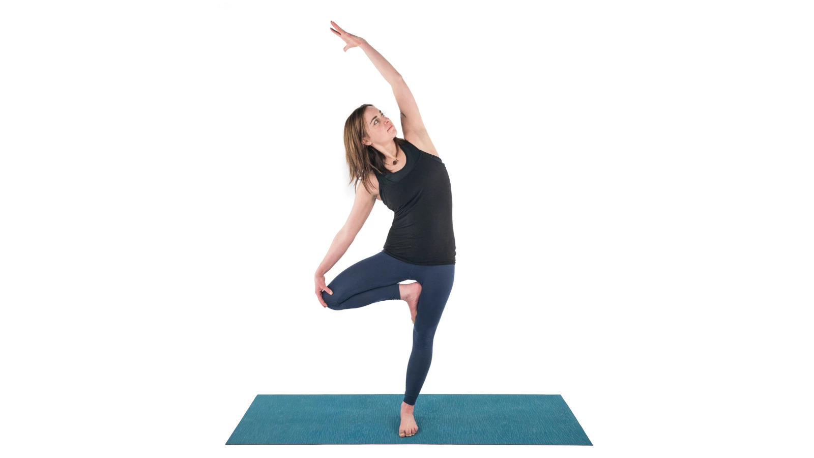 woman practicing swaying tree yoga pose