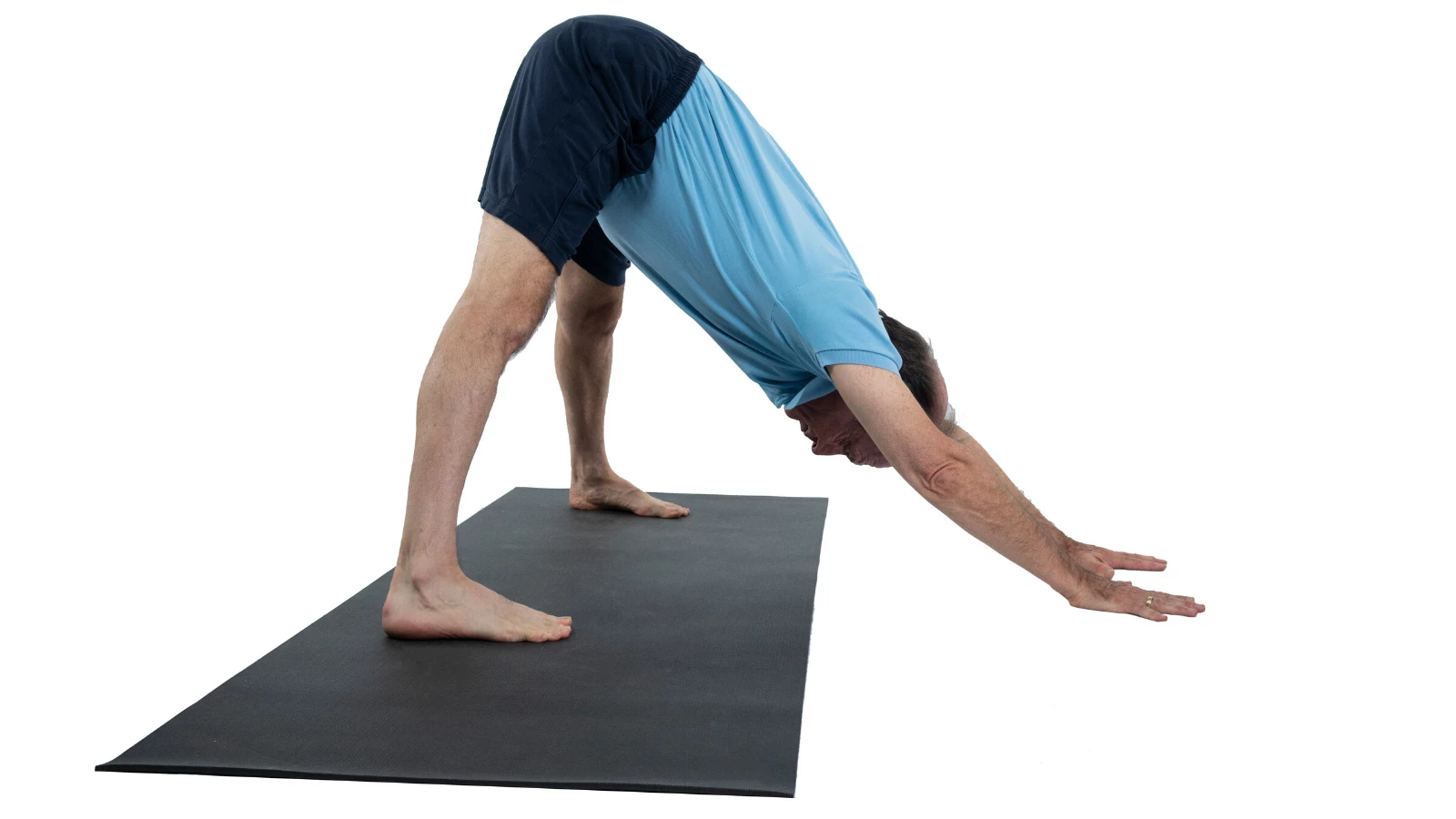 man practicing yoga downward facing dog with wide legs