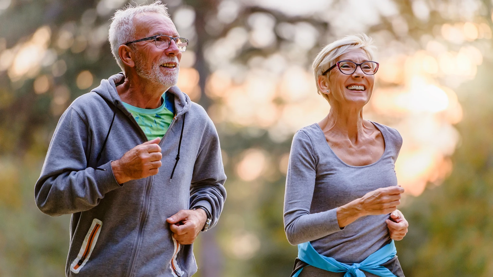 couple who practice yoga exercising in nature to boost immune system