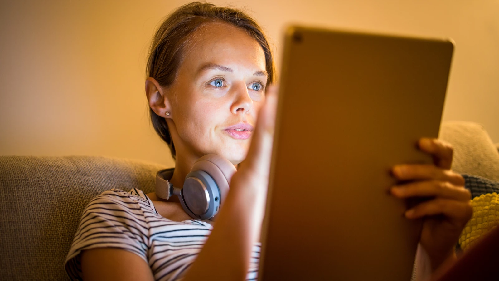 young woman staring at her ipad screen