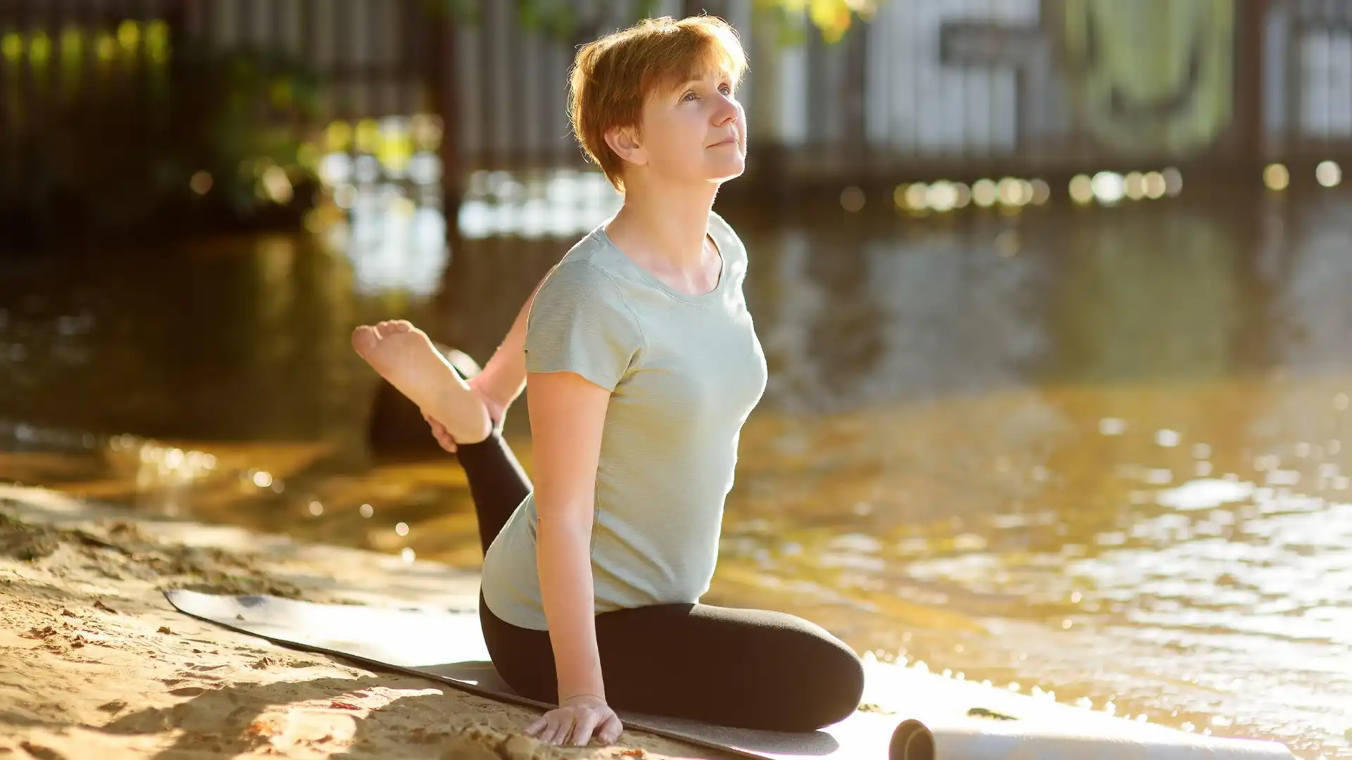 Older Beginner Yoga Student Enjoying the Benefits of Pigeon Pose in Yoga