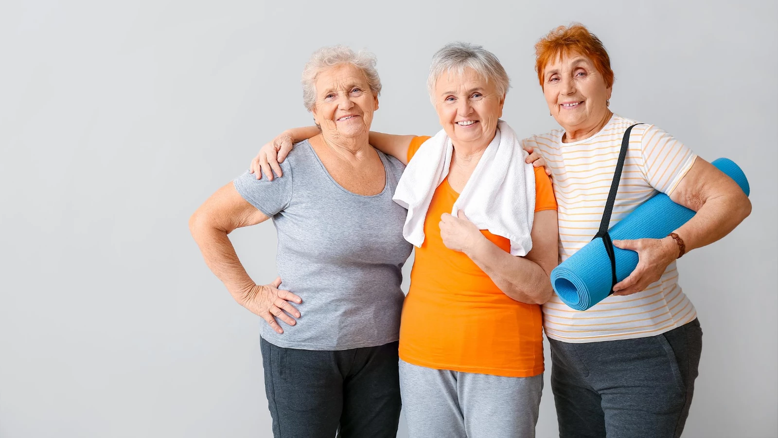 Older beginner yoga students learning tips for practicing yoga