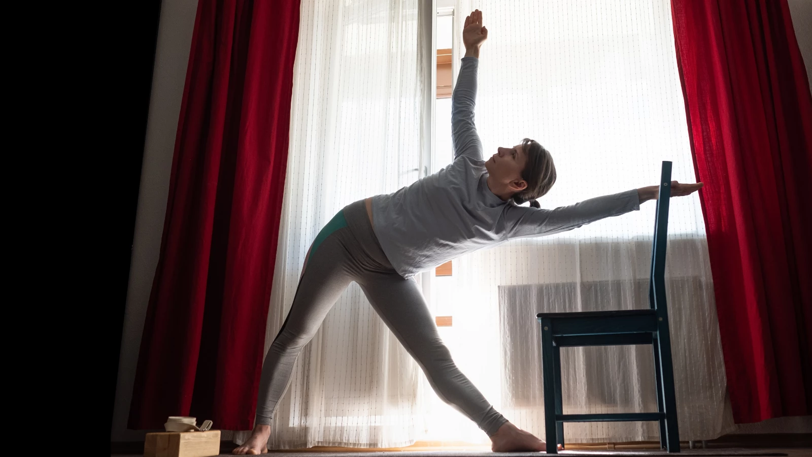 How to practice the full expression of Triangle Pose (Sanskrit name: Trikonasana) with a chair