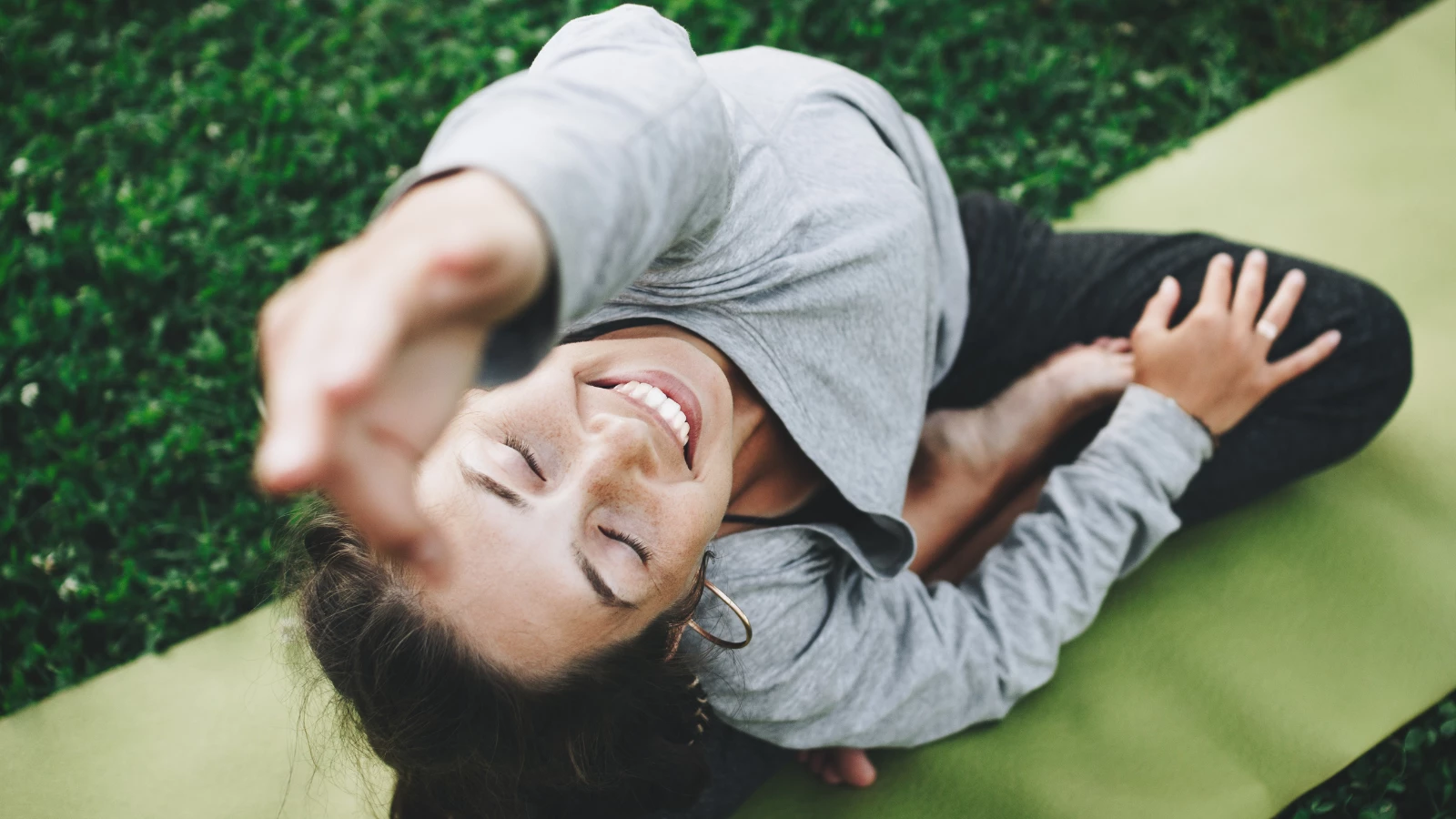 Yoga practitioner practicing principles of self-exploration and attuning to mind, body, and food