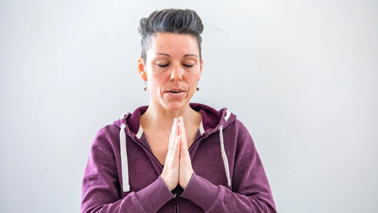 Yoga student experiencing the benefits of connecting the mind and body through the power of the breath