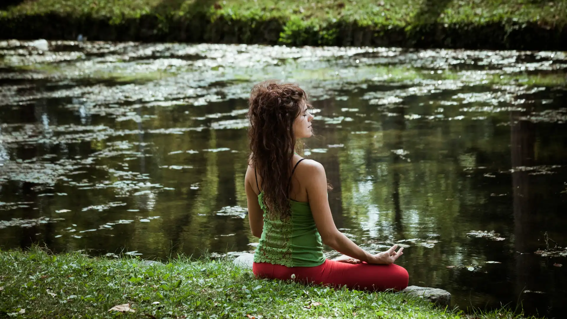 Yoga student practicing outside to promote well-being