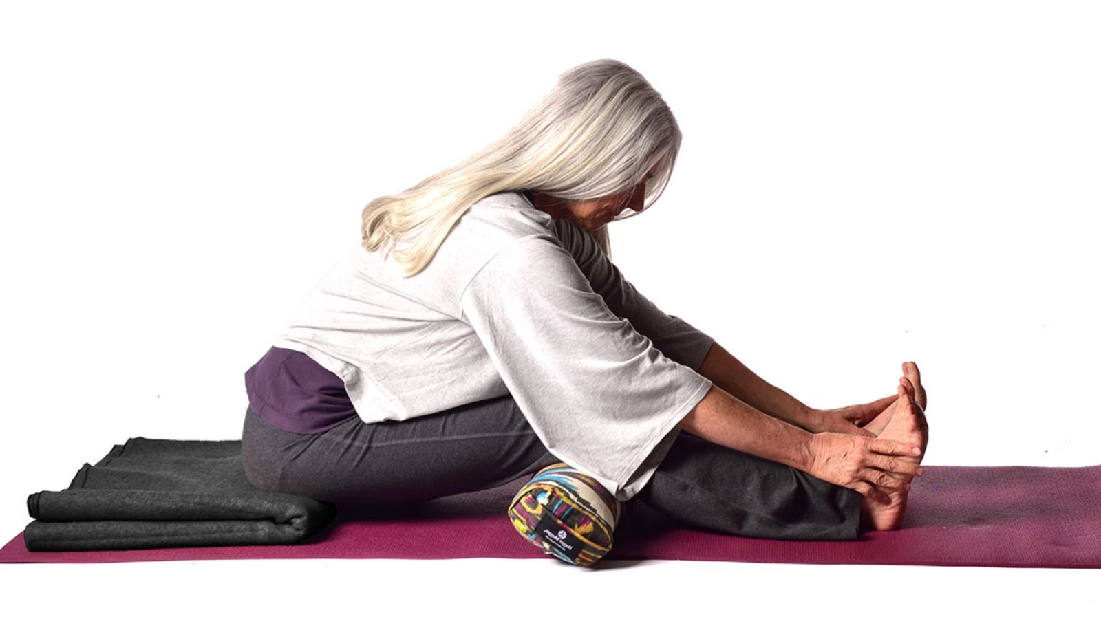 How to maintain spinal integrity in forward folds in Seated Forward Bend Pose (Paschimottanasana) with props