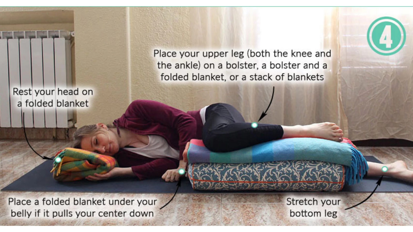 A yoga modification for pregnancy: Side-Lying Savasana pose with bent upper knee and props for pregnant students