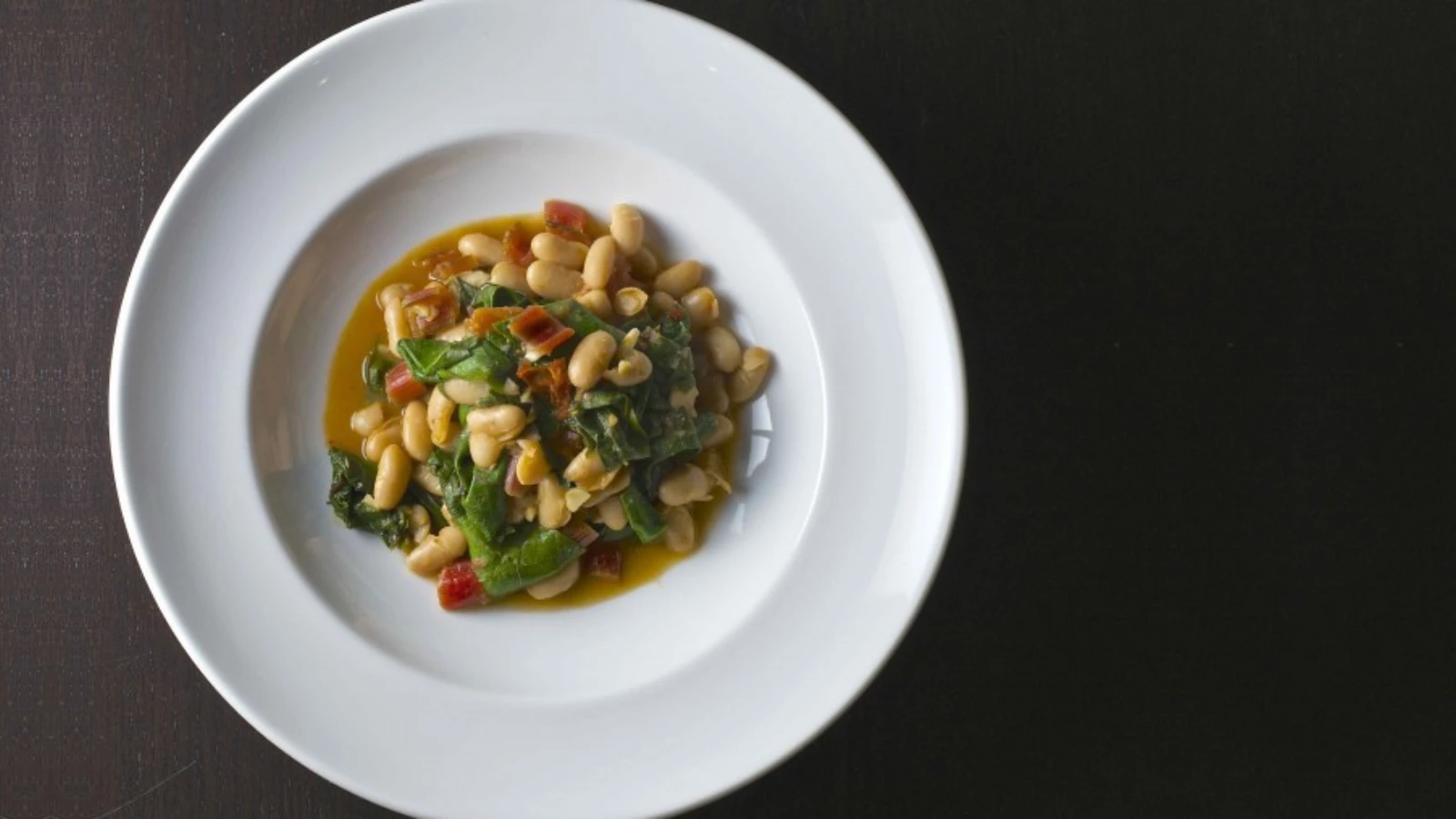 Warm and delicious healthy recipe for chard and white bean ragout perfect for cold winter nights