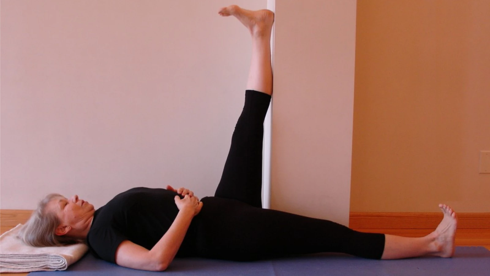 How to enjoy stretching your hamstrings in yoga with Extended Hand-to-Big-Toe Pose (Utthita Hasta Pandangusthasana) against wall