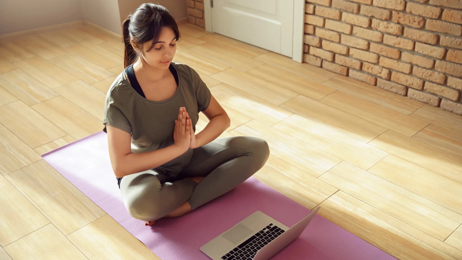 Yoga student practicing at home during the pandemic