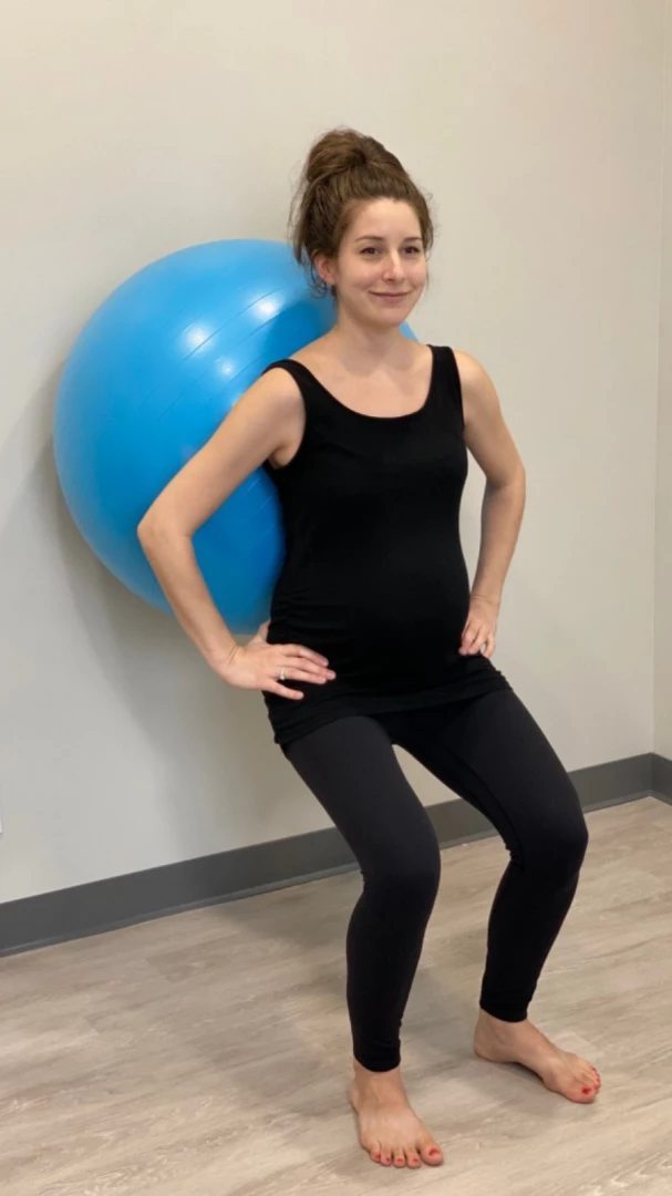 How to practice Wall Squats (Malasana) with an exercise ball for pregnancy yoga students to activate pelvic floor muscles