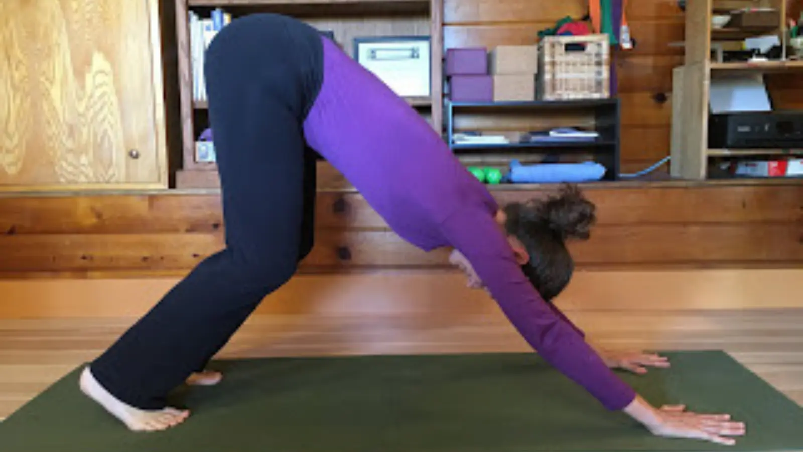 Downward Facing Dog Pose practiced with bent knees for tight hamstrings. 