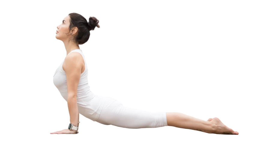 young woman in white sportswear practicing Upward Facing Dog pose or Urdhva Mukha Svanasana