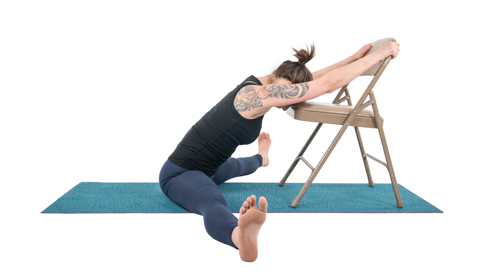 Practicing yoga's forward folds with a chair to support your arms and legs.
